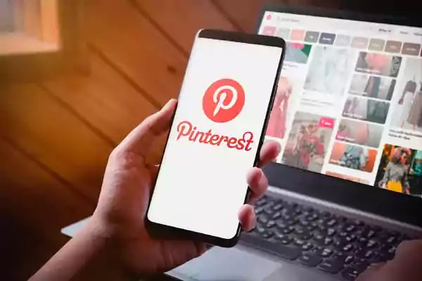 Mobile phone with the Pinterest app on display.