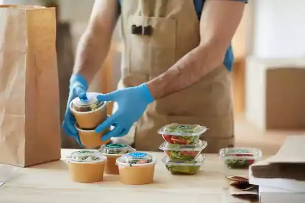 Packaging up food to go.