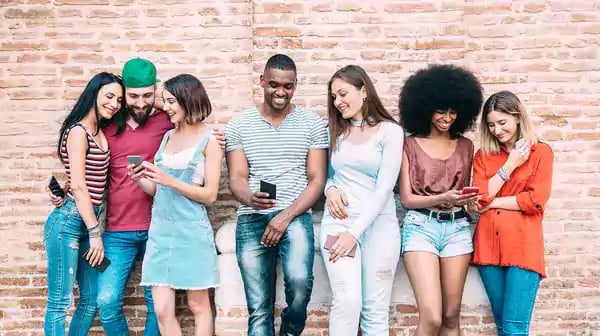 Group of young adults smiling.