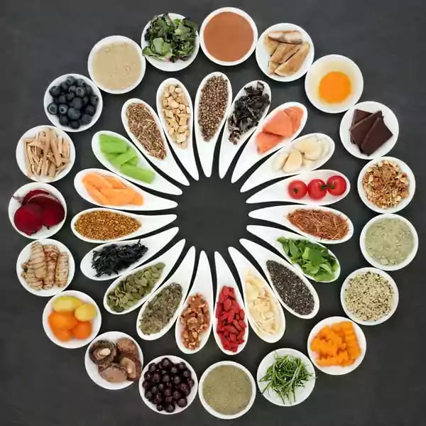 Bowls filled with fruits and vegetables.