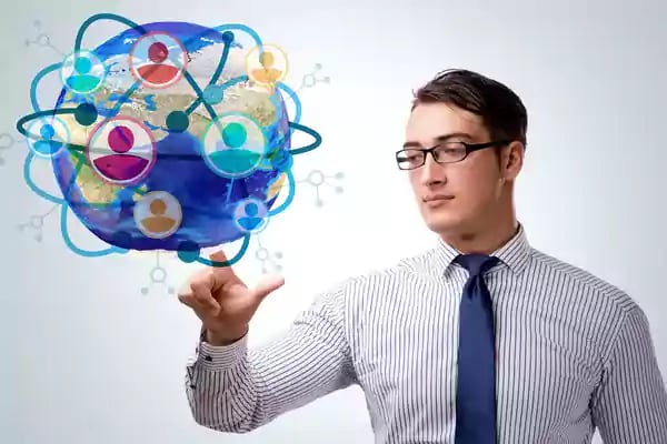 Man spinning a globe on his index finger.